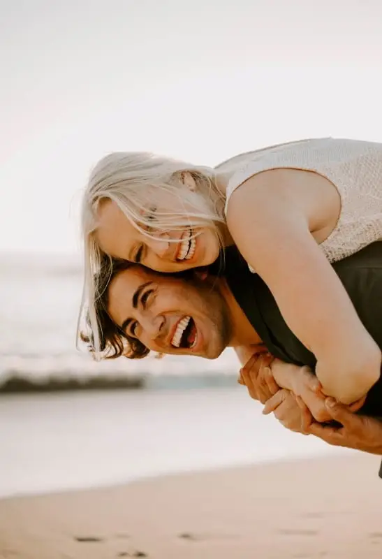 happy couple with a smiling face on the beach